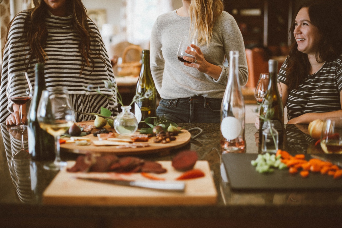 three ladies enjoying wine